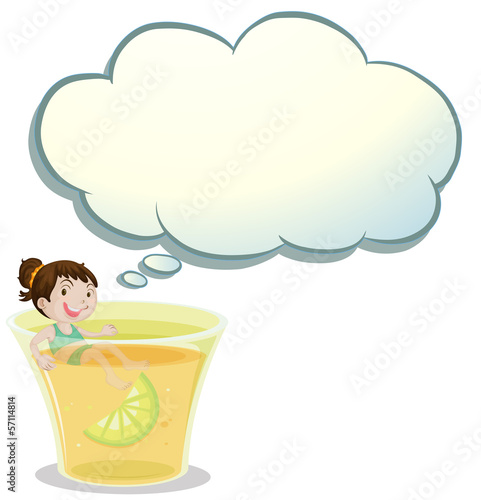 A smiling child swimming on a glass of lemonade