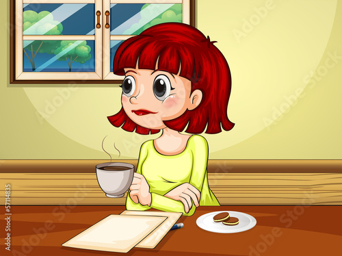 A woman inside the house sitting at the table with a cup of hot