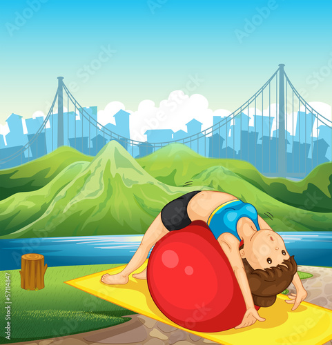 A young woman exercising near the river