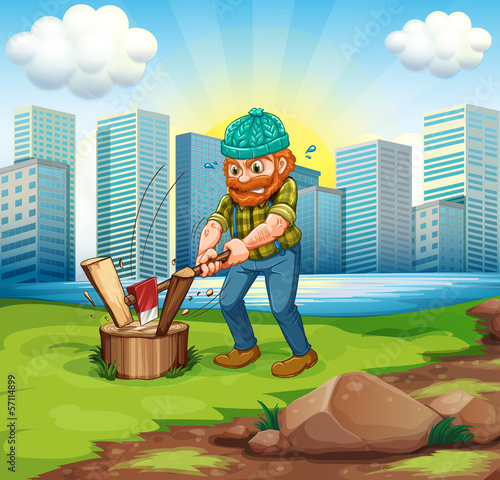 A man chopping woods across the tall buildings
