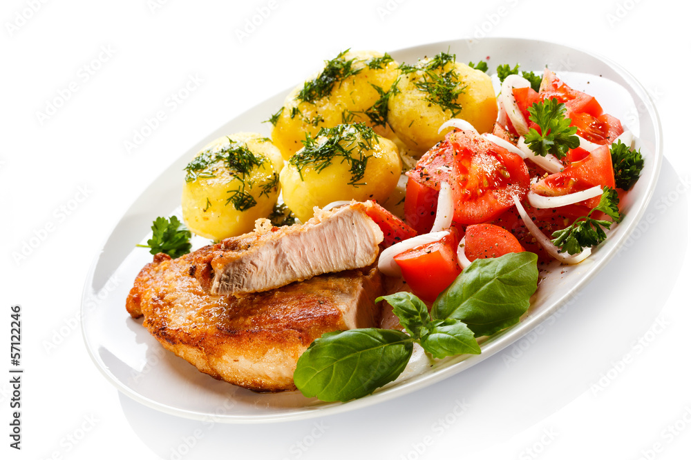 Grilled steaks, boiled potatoes and vegetable salad Grilled steaks, boiled potatoes and vegetable salad