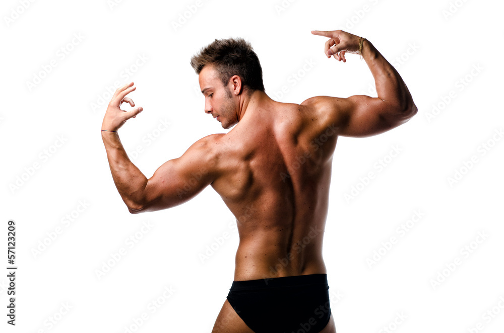 Attractive young muscular man naked posing, seen from the back Attractive young muscular man naked posing, seen from the back