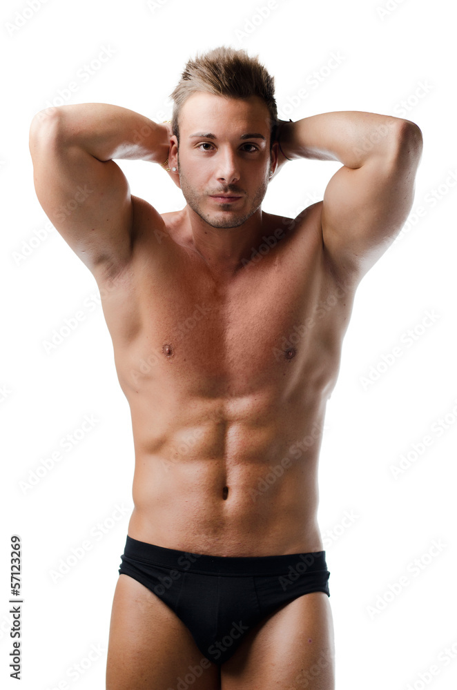Handsome young muscular man showing ripped abs Handsome young muscular man showing ripped abs