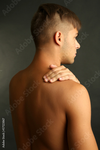 Young man with neck pain on...