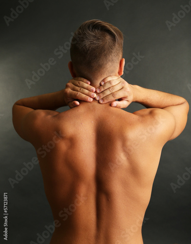 Young man with neck pain on...