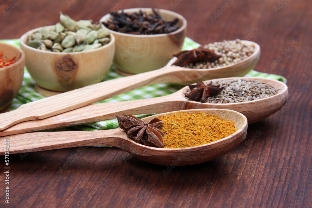 Various spices and herbs on wooden background Various spices and herbs on wooden background