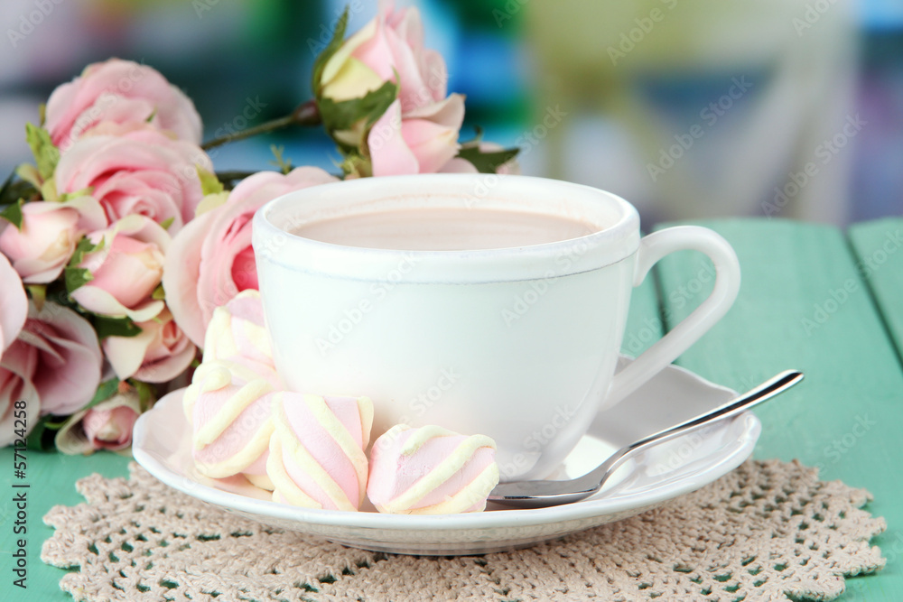 Cocoa drink on wooden table, on bright background Cocoa drink on wooden table, on bright background