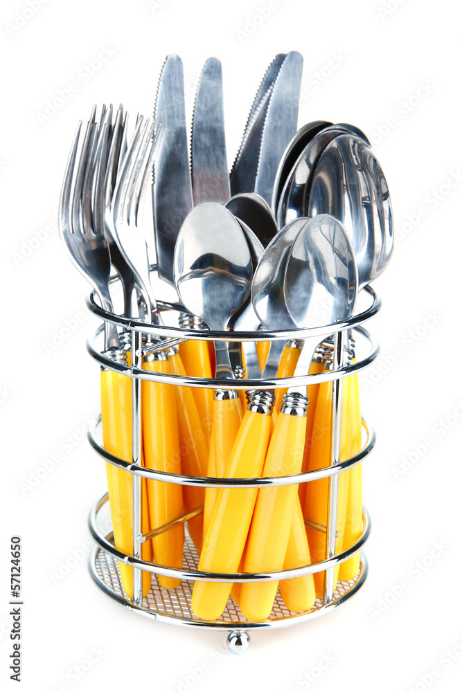 Knives, forks and spoons in metal stand isolated on white Knives, forks and spoons in metal stand isolated on white