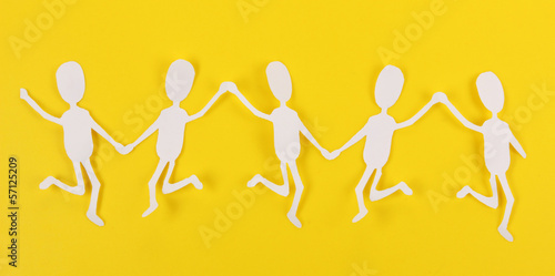 Paper people in social network concept on yellow background