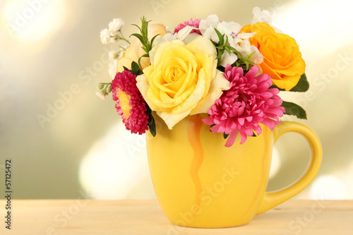 Fototapeta Naklejka Na Ścianę i Meble -  Beautiful bouquet of bright flowers in color mug,