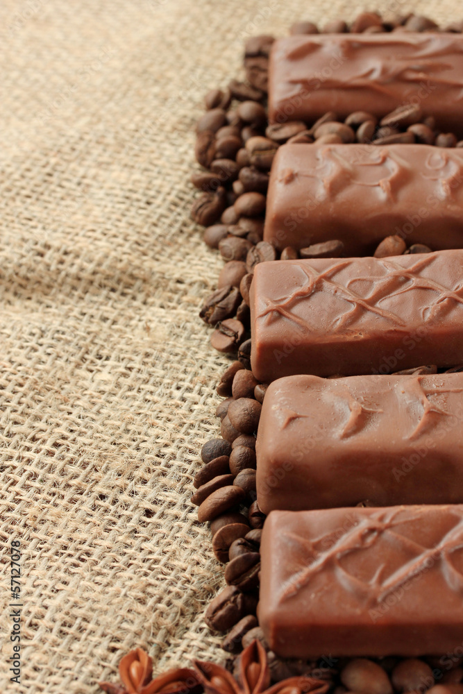 Naklejka premium Delicious chocolate bars with coffee beans