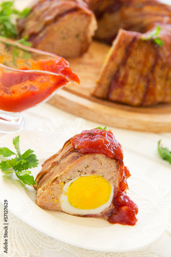 Meat roll with an Easter egg. Meat roll with an Easter egg.