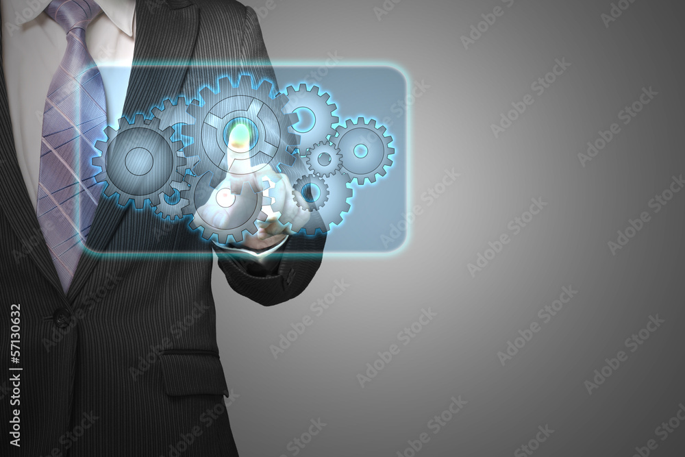 Businessman touch cloud shape filled with gears icon in space fo Businessman touch cloud shape filled with gears icon in space fo