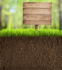 soil cut in garden with wooden sign