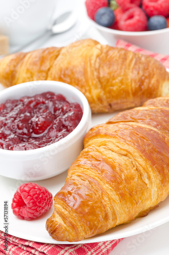 delicious breakfast - fresh croissant with raspberry jam