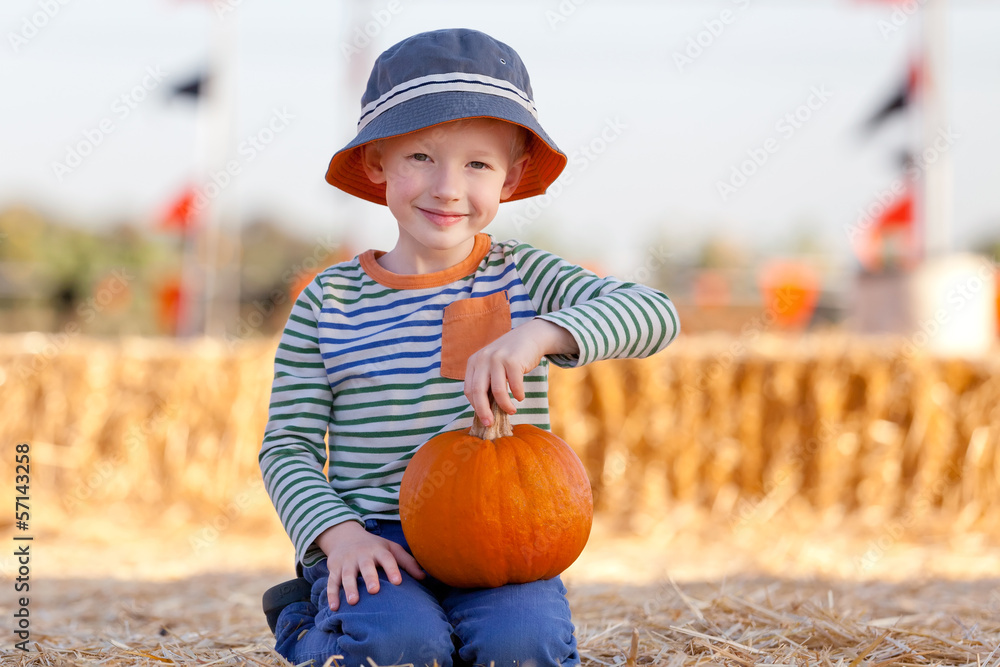 Fototapeta premium kid at pumpkin patch