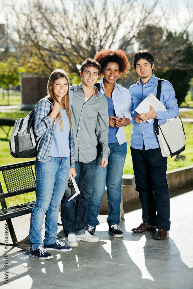 Fototapeta premium Confident Students Standing In Campus