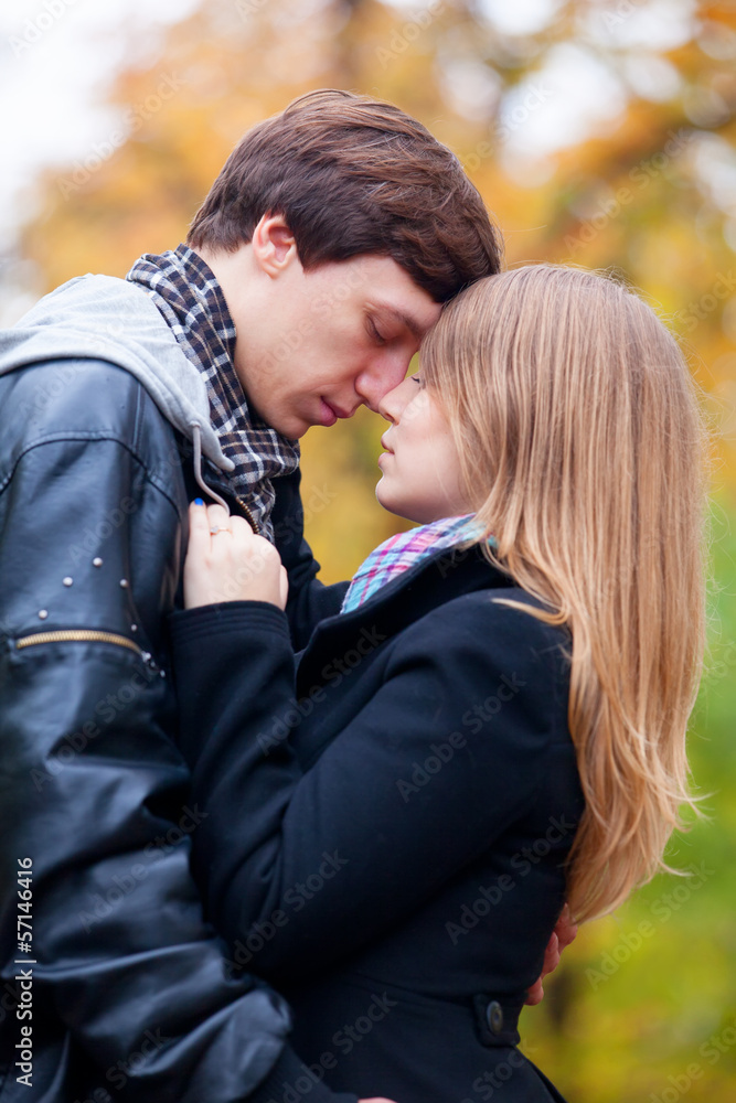 couple kissing at outdoor in the park couple kissing at outdoor in the park