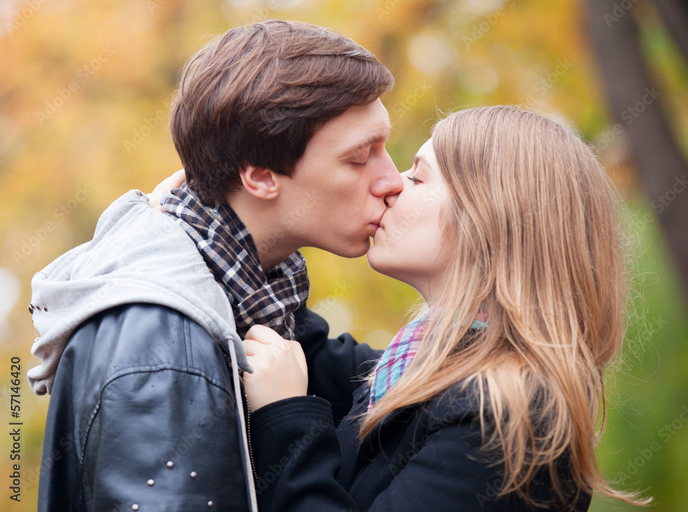 couple kissing at outdoor in the park couple kissing at outdoor in the park