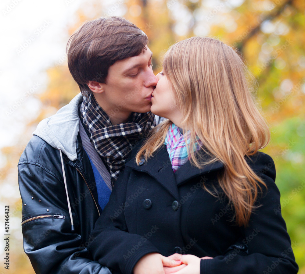 couple kissing at outdoor in the park couple kissing at outdoor in the park