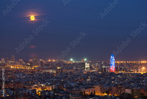 Barcelona at night with full moon, Spain