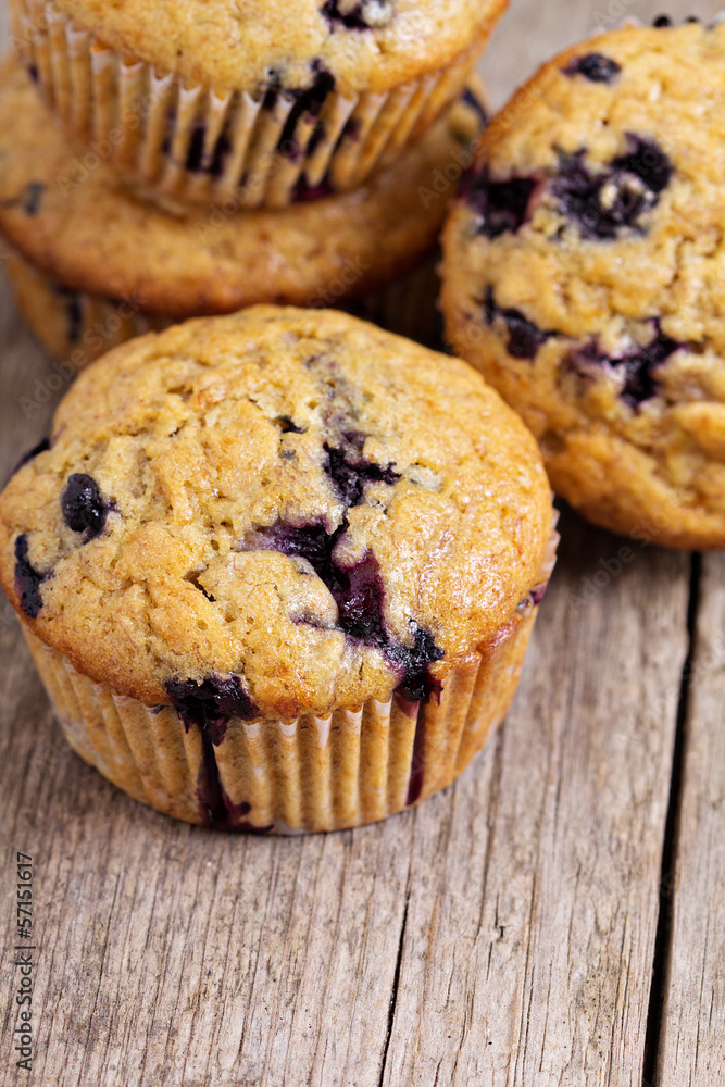 Healthy blueberry banana muffins on a wooden table Healthy blueberry banana muffins on a wooden table