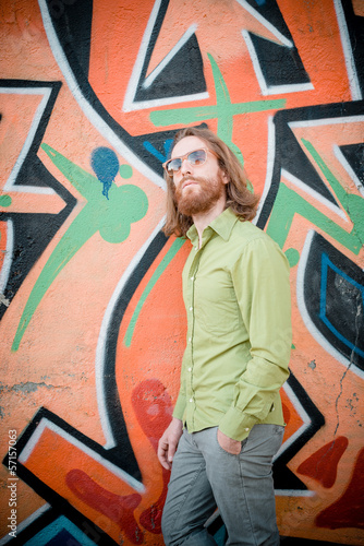 stylish hipster model with long red hair and beard lifestyle