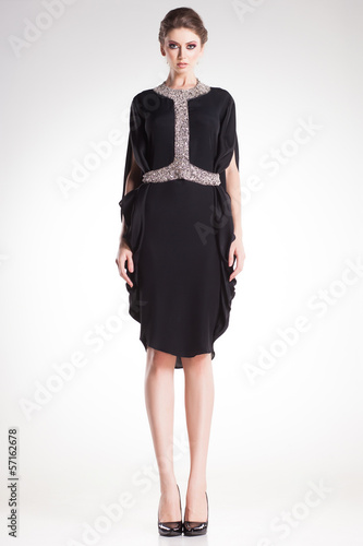 beautiful woman model in elegant black dress with diamonds