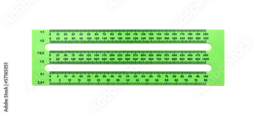 green plastic ruler on a white background