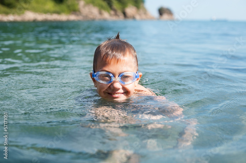 Joyful boy swims in the sea © Stanislav Komogorov