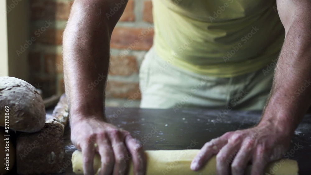 man rolling dough, slow motion at 60 fps man rolling dough, slow motion at 60 fps