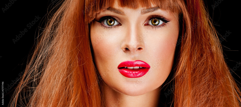 Fototapeta premium Red Hair. Fashion Girl Portrait. long Hair and red lipstick.