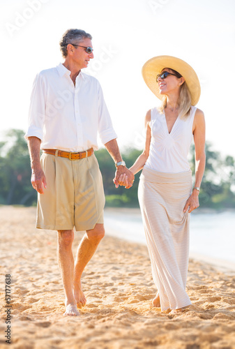 Middle Aged Couple Enjoying Walk on the Beach