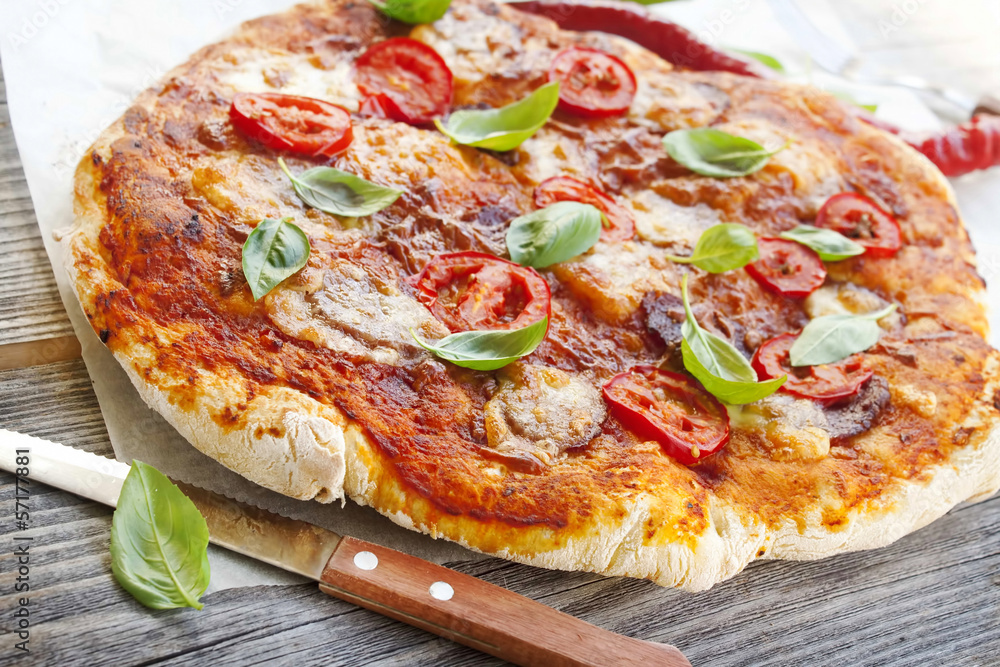 Pizza with salami and basil homemade Pizza with salami and basil homemade