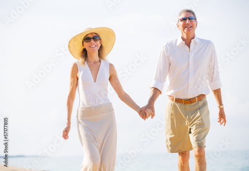 Middle Aged Couple Enjoying Walk on the Beach © EpicStockMedia