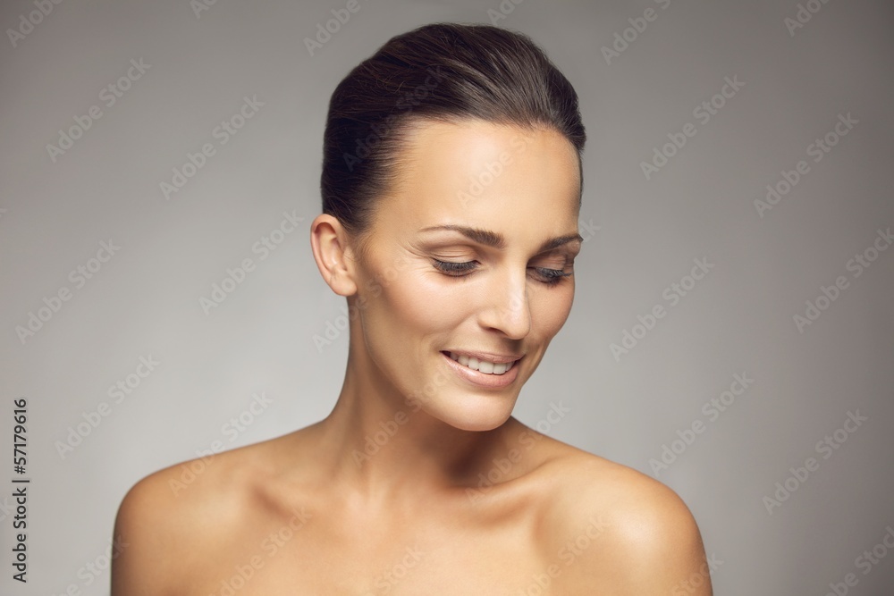 Natural beauty posing on gray background Natural beauty posing on gray background