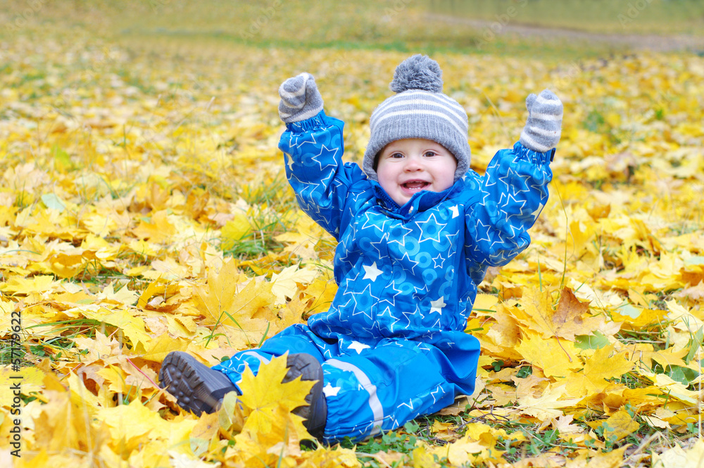 funny smiling baby age of 1 year outdoors in autumn funny smiling baby age of 1 year outdoors in autumn