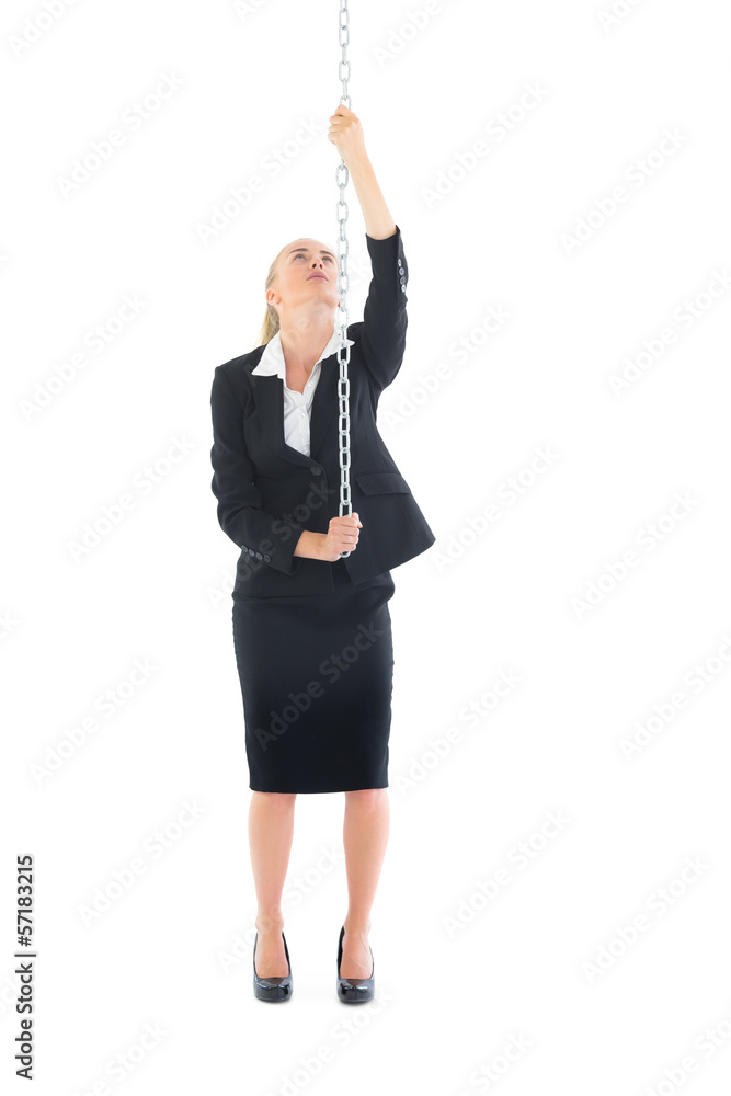 Front view of businesswoman climbing a chain Front view of businesswoman climbing a chain