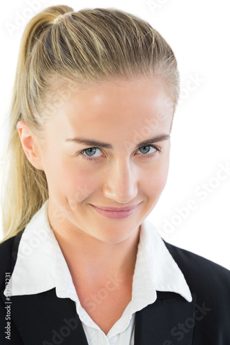 Portrait of impish ponytailed businesswoman