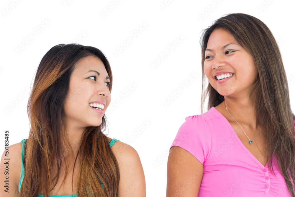 Two pretty asian women posing for the camera Two pretty asian women posing for the camera