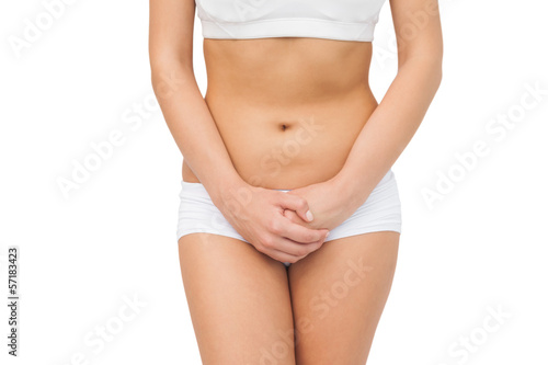 Slim woman wearing a sports bra posing