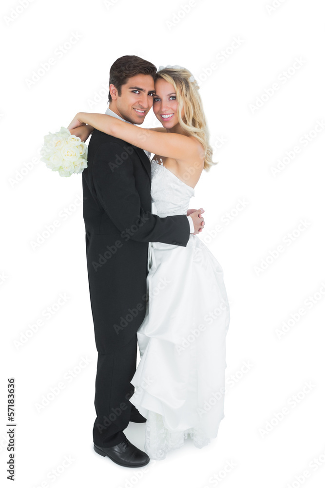 Pretty young bride holding a white bouquet
