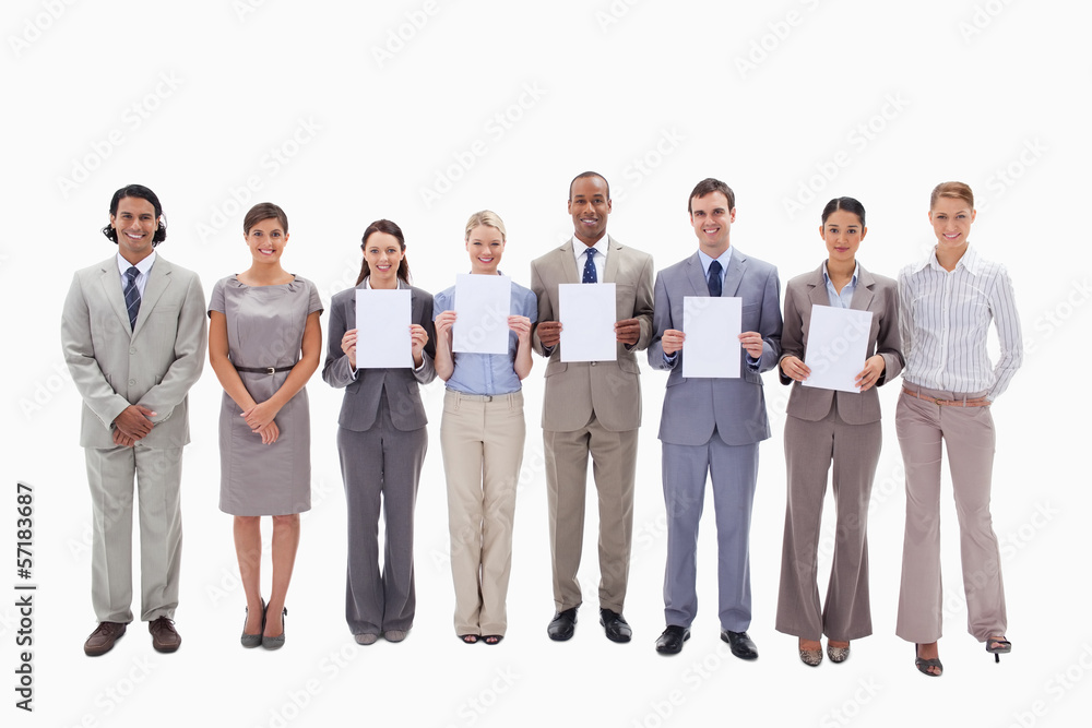 Happy business people holding five supports for letters Happy business people holding five supports for letters