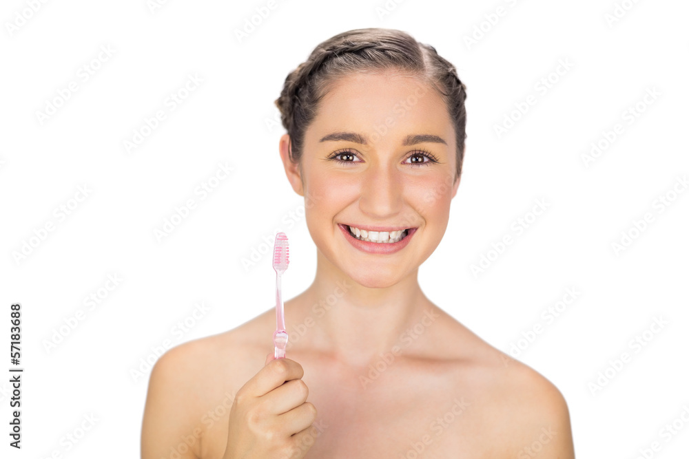 Cheerful young model holding toothbrush Cheerful young model holding toothbrush