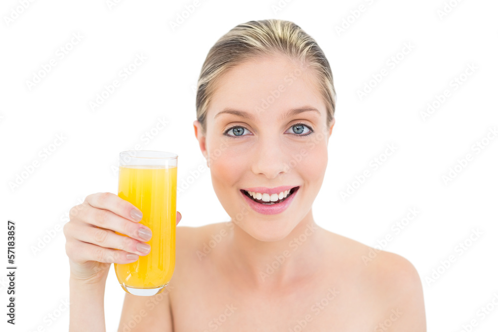 Charming fresh blonde woman holding a glass of orange juice Charming fresh blonde woman holding a glass of orange juice