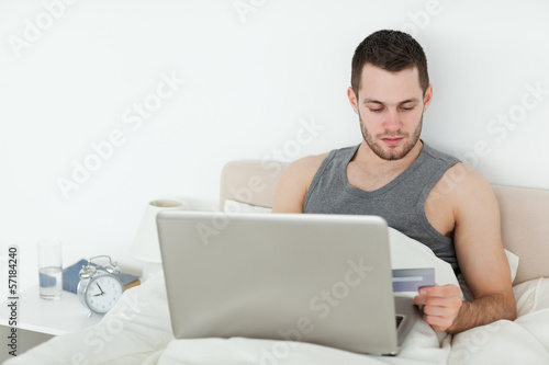 Attractive man shopping online