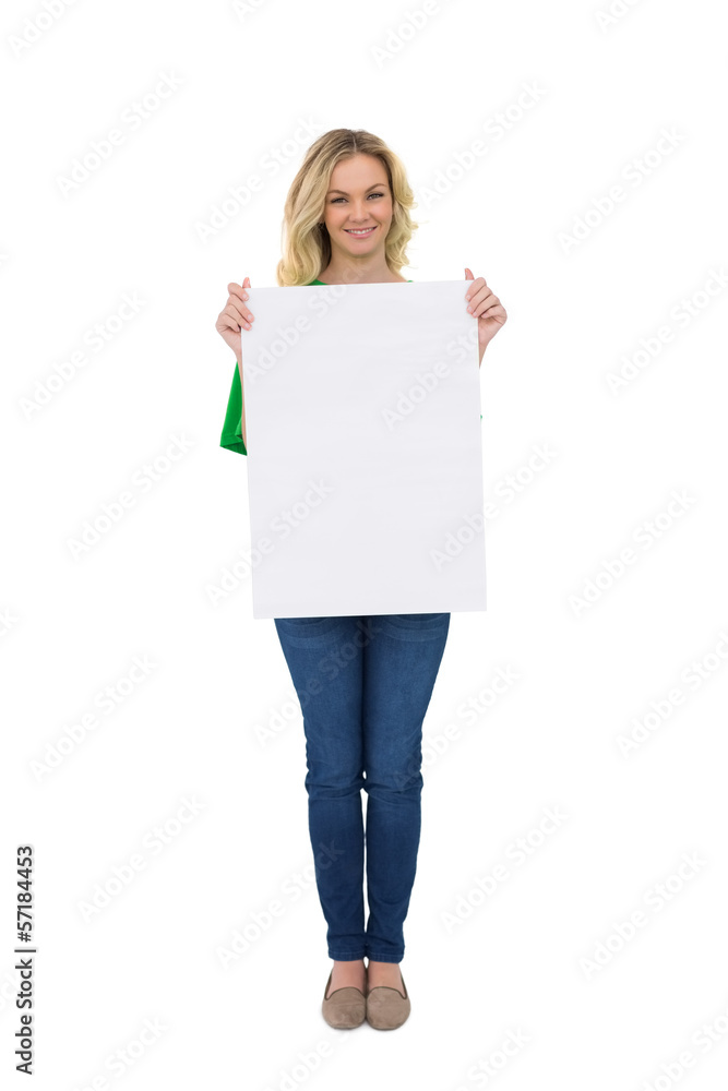 Smiling cute blonde holding white sign Smiling cute blonde holding white sign