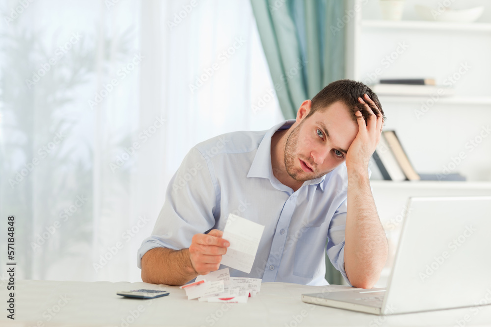 Businessman worried about an invoice Businessman worried about an invoice