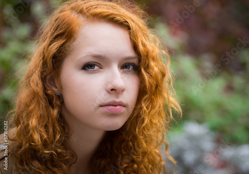 Beautiful redhead girl face closeup.