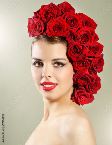 Portrait of smiling girl with red roses hairstyle © Anton Maltsev